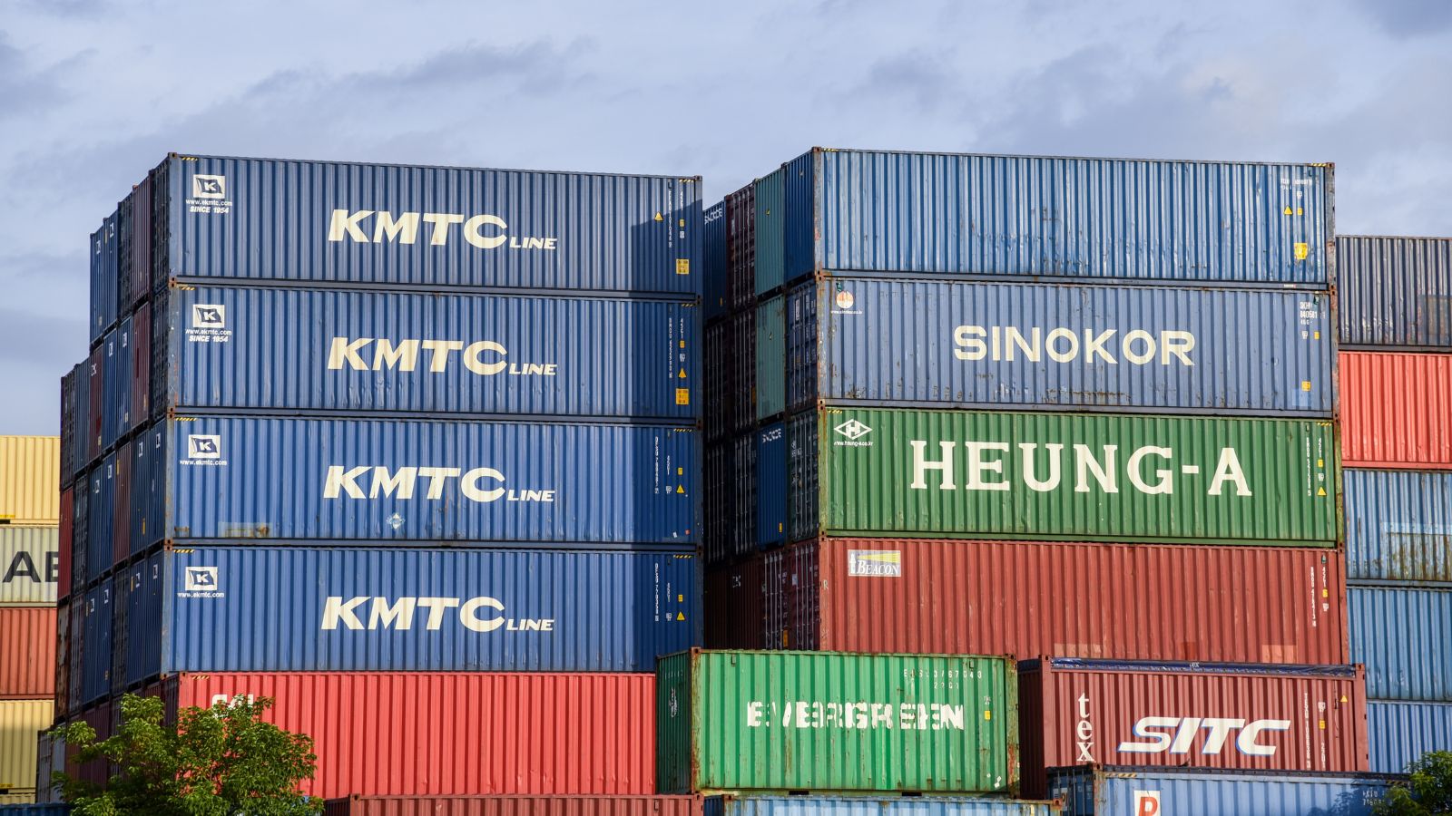 stacked High Cube intermodal containers at a Kansas City rail yard